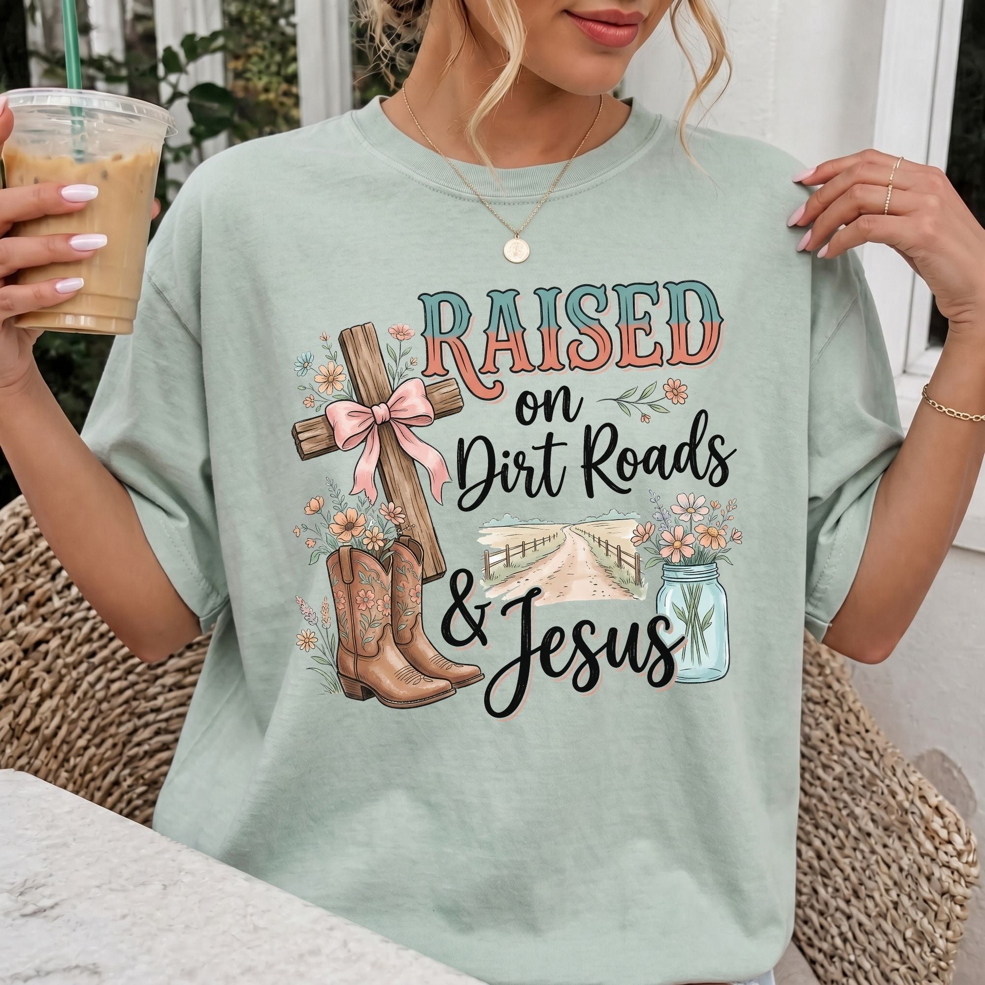 Woman wearing Raised on Dirt Roads & Jesus Christian Comfort Colors T-Shirt in Bay