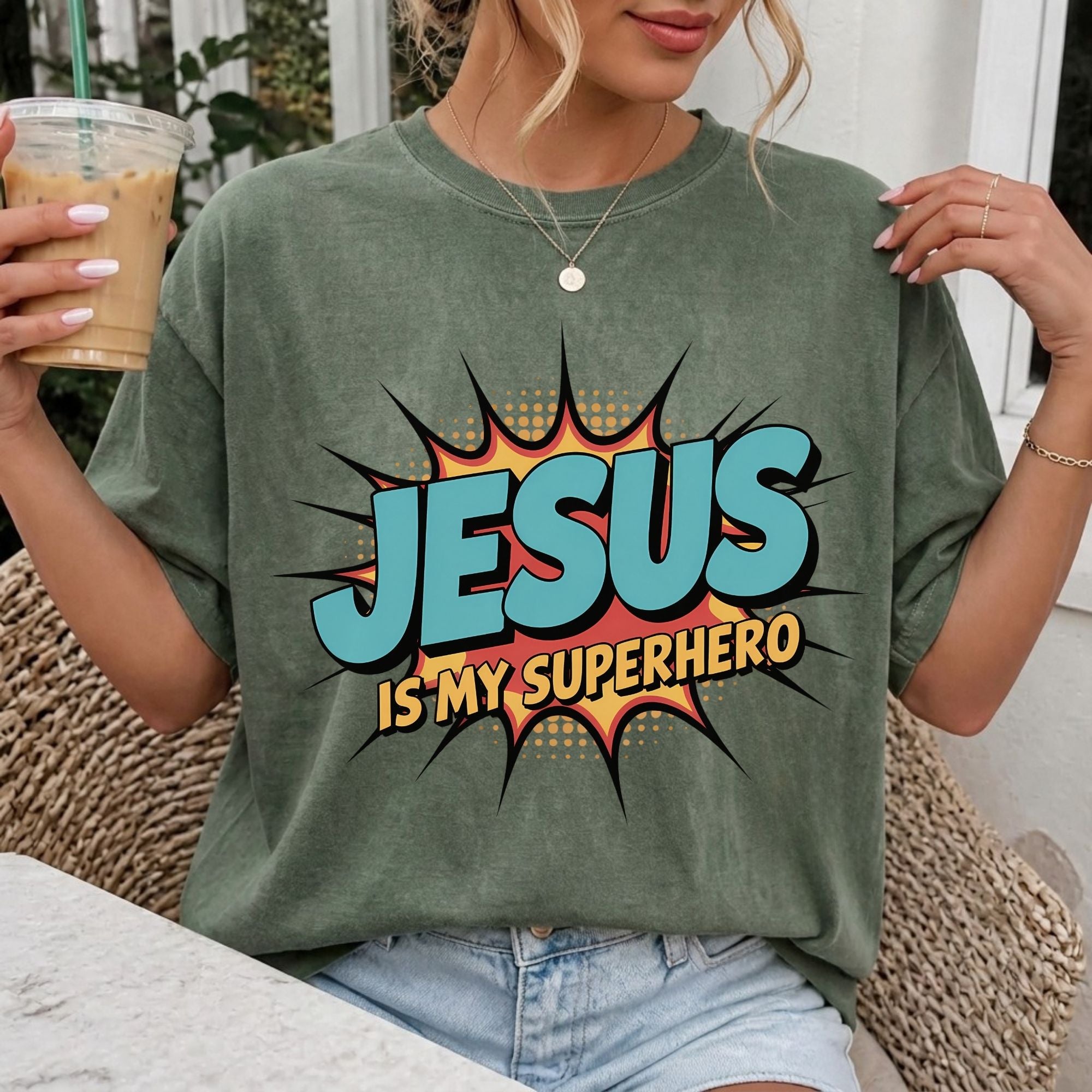 Woman wearing Jesus Is My Superhero Christian Comfort Colors T-Shirt in Moss