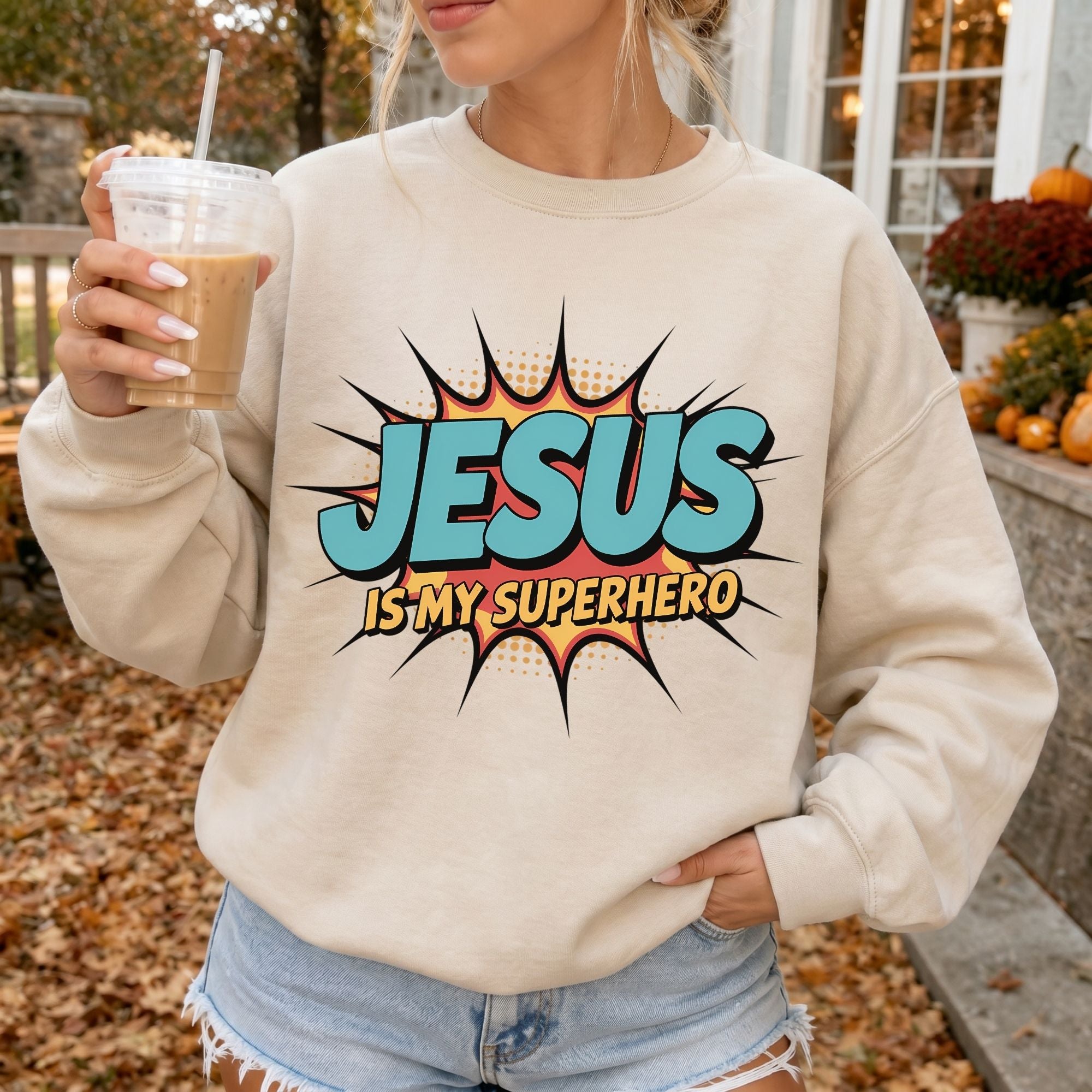 Woman wearing Jesus Is My Superhero Christian sweatshirt in Sand