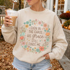 Woman wearing Even in the Chaos His Grace Still Finds Me Christian sweatshirt in Sand