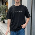 Man wearing Jesus Is King Christian Comfort Colors T-Shirt in Black
