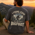 Man wearing I Found Jesus Still Looking for Bigfoot Christian Comfort Colors T-Shirt in Pepper