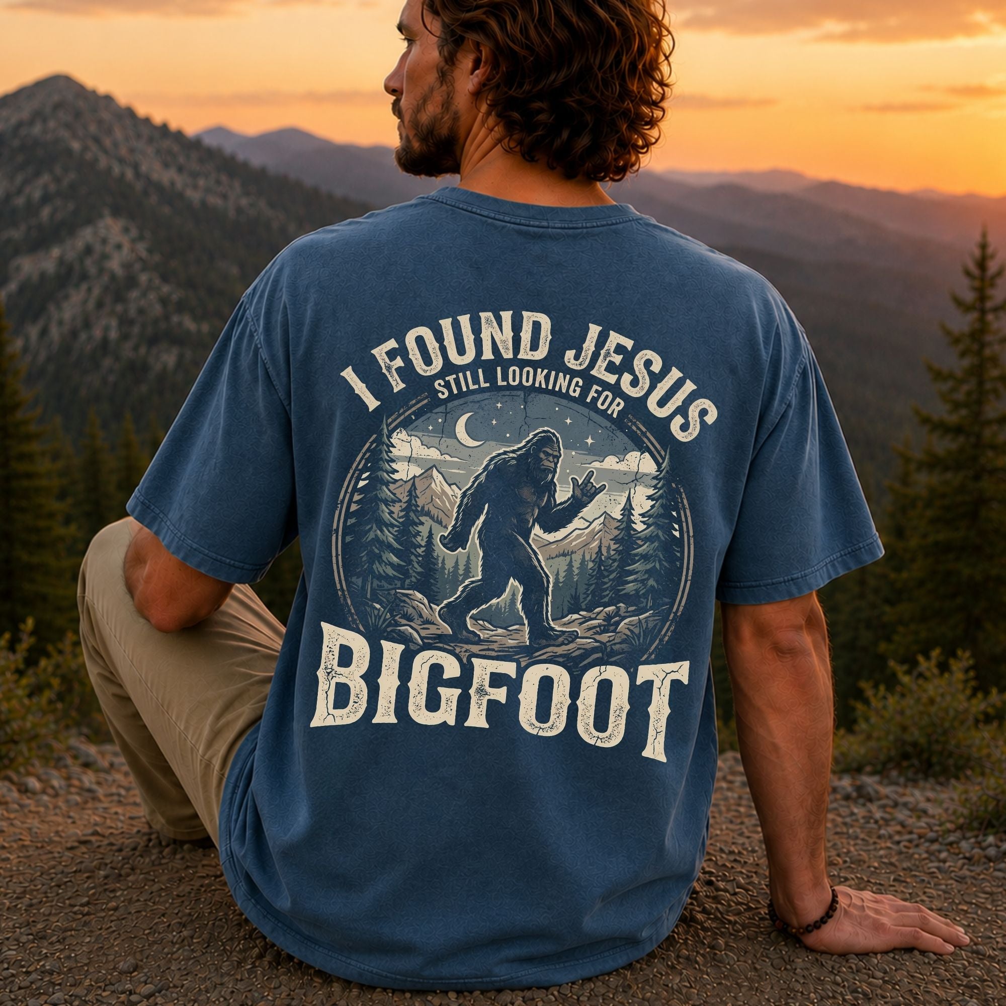 Man wearing I Found Jesus Still Looking for Bigfoot Christian Comfort Colors T-Shirt in Midnight