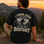 Man wearing I Found Jesus Still Looking for Bigfoot Christian Comfort Colors T-Shirt in Black