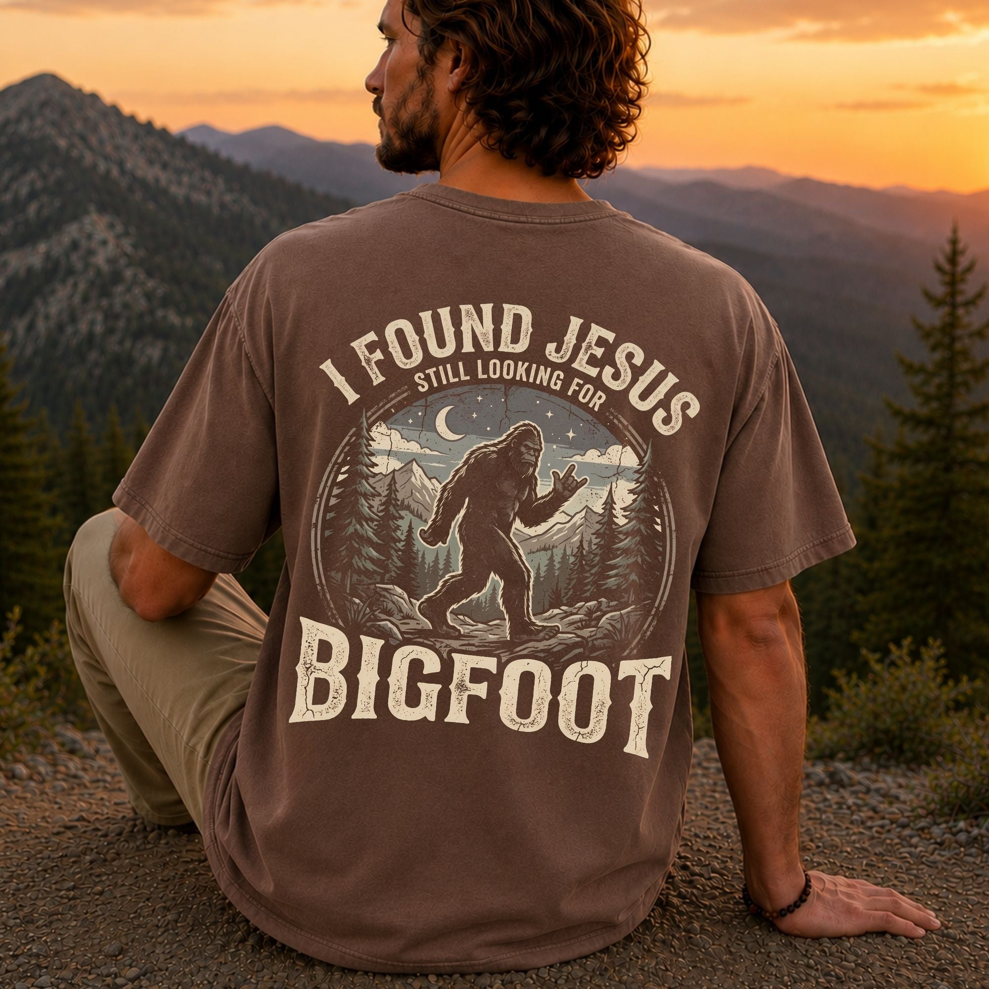 Man wearing I Found Jesus Still Looking for Bigfoot Christian Comfort Colors T-Shirt in Espresso