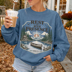 Woman wearing Rest in His Presence Christian sweatshirt in Indigo Blue