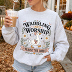 Woman wearing Waddling Into Worship Christian sweatshirt in Ash