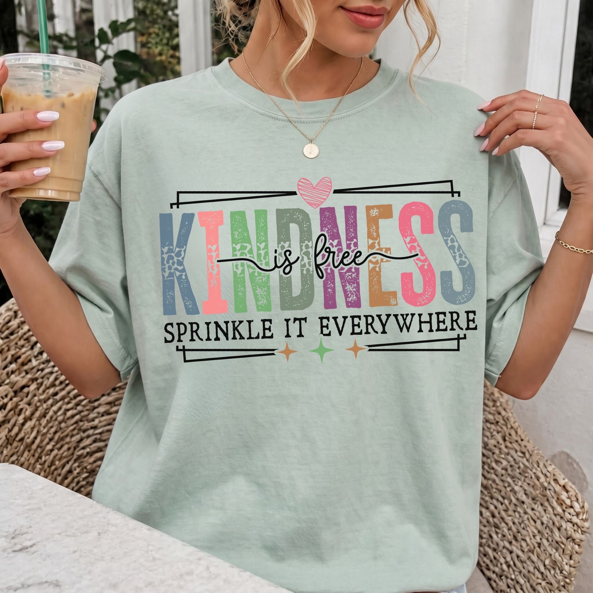 Woman wearing Kindness Is Free Comfort Colors Inspirational T-Shirt in Bay
