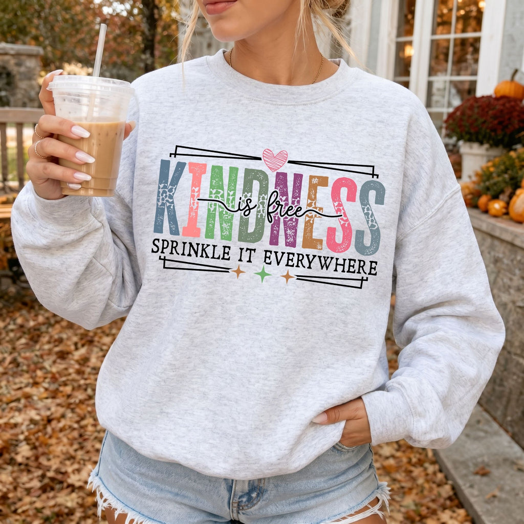 Woman wearing Kindness Is Free Inspirational sweatshirt in Ash