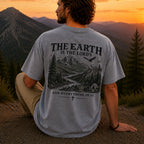 Man wearing The Earth Is the Lord's Christian Comfort Colors T-Shirt in Grey