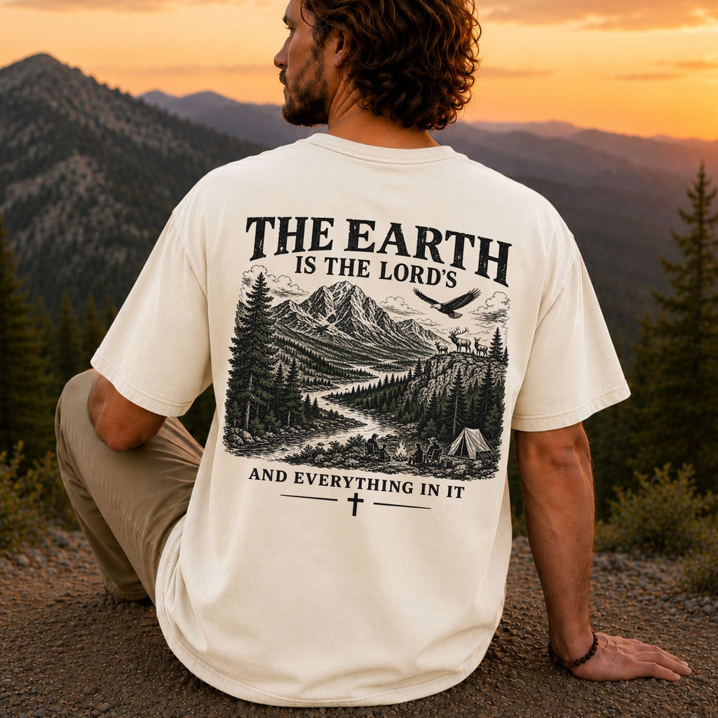Man wearing The Earth Is the Lord's Christian Comfort Colors T-Shirt in Ivory