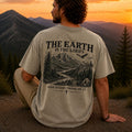 Man wearing The Earth Is the Lord's Christian Comfort Colors T-Shirt in Khaki