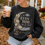 Woman wearing Even Here He Is Good Christian sweatshirt in Black