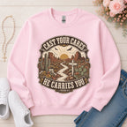 Cast Your Cares He Carries You Christian sweatshirt in Light Pink