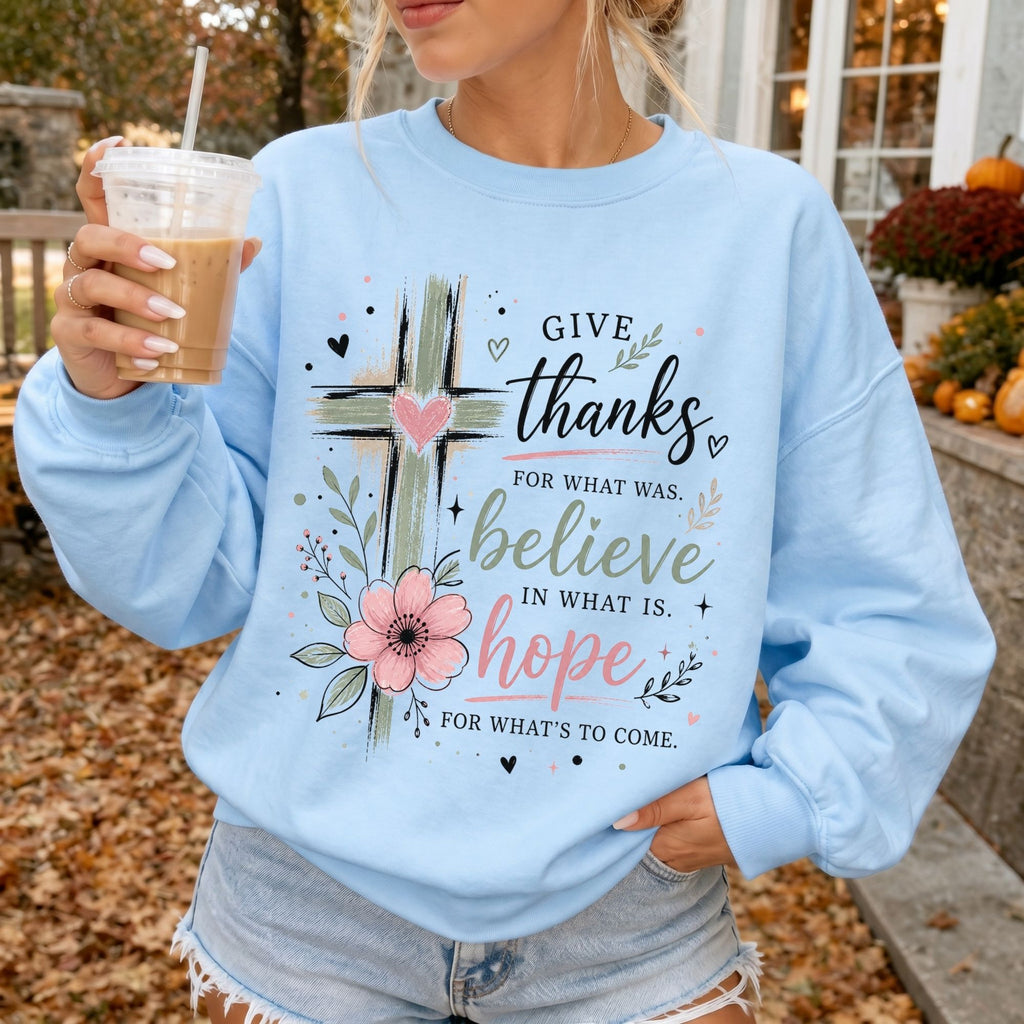 Woman wearing Give Thanks Believe Hope Christian sweatshirt in Light Blue