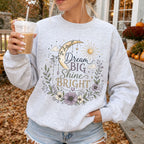 Woman wearing Dream Big Shine Bright Christian sweatshirt in Ash