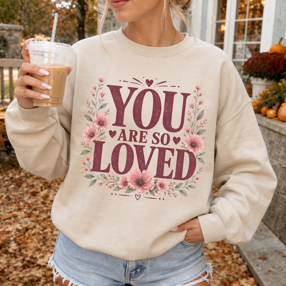 Woman wearing You Are So Loved Christian sweatshirt in Sand
