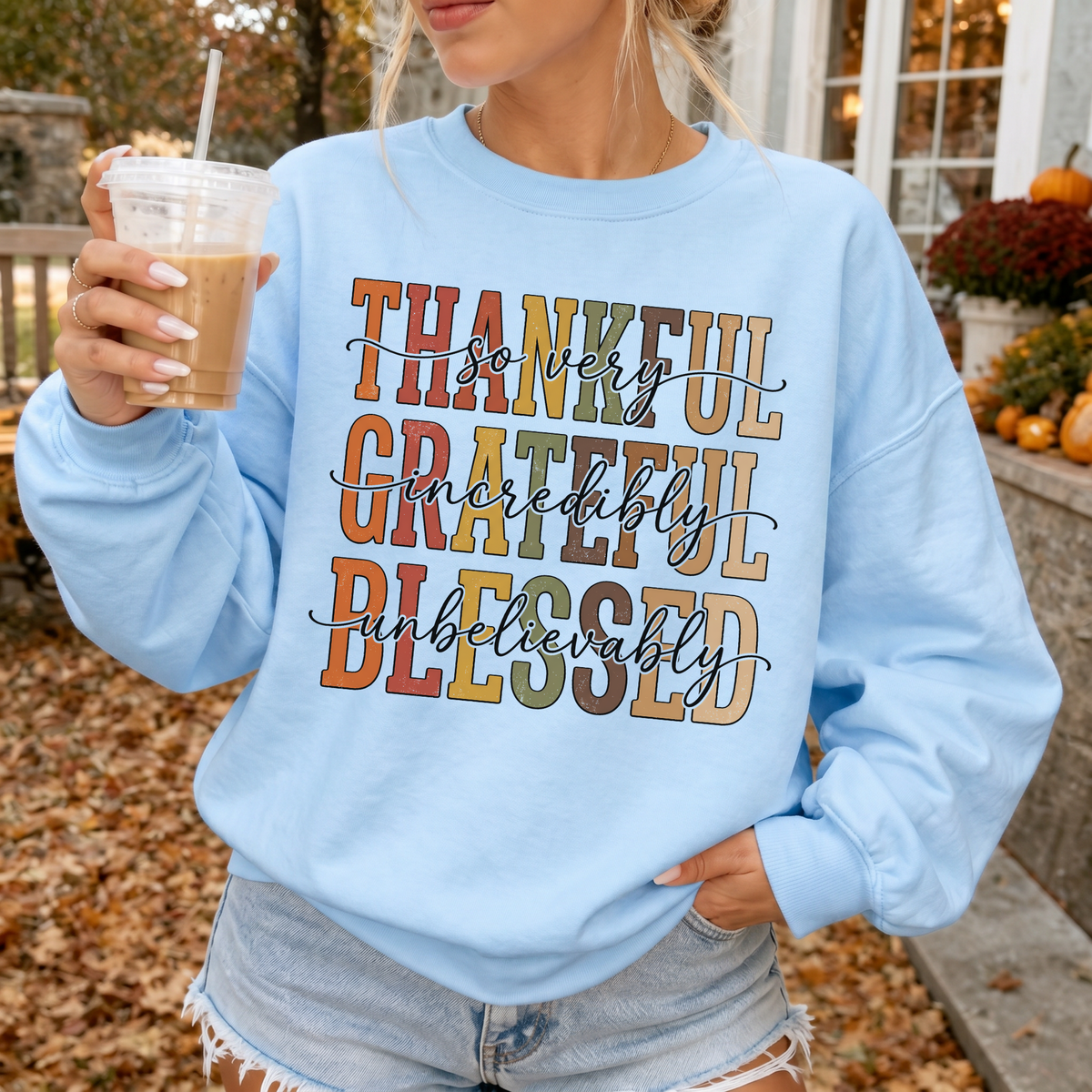 Woman wearing Thankful Grateful Blessed Christian sweatshirt in Light Blue