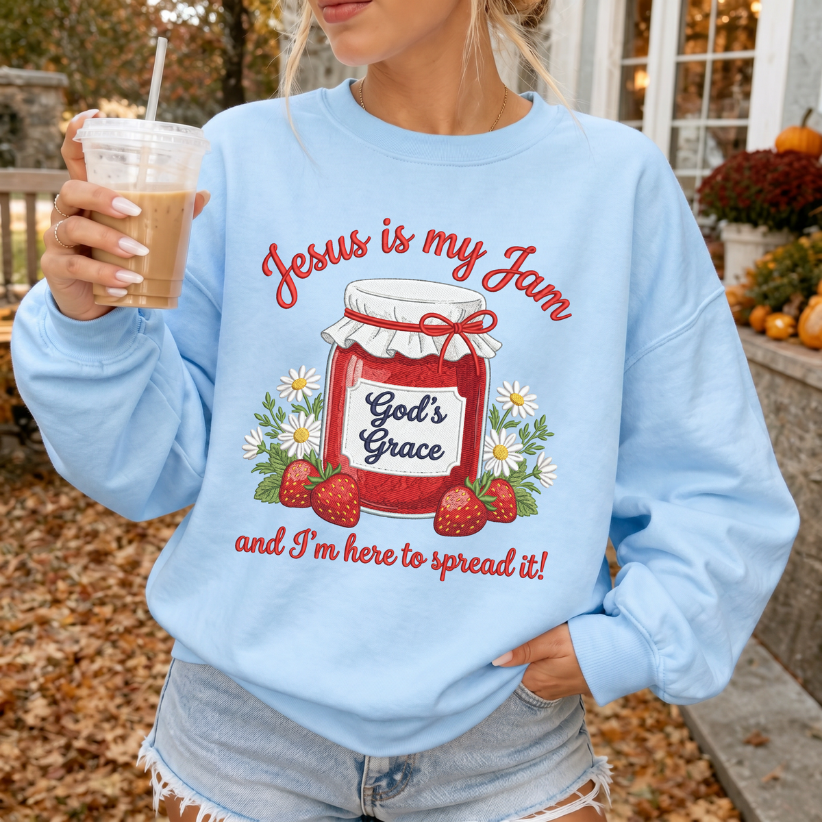 Woman wearing Jesus Is My Jam Christian sweatshirt in Light Blue