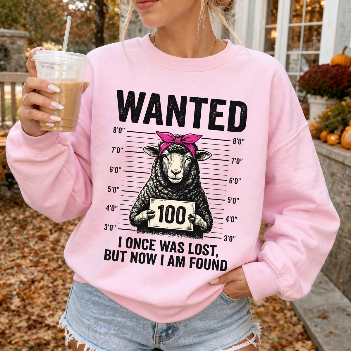 Woman wearing Wanted Sheep Lost But Found Christian sweatshirt in Light Pink