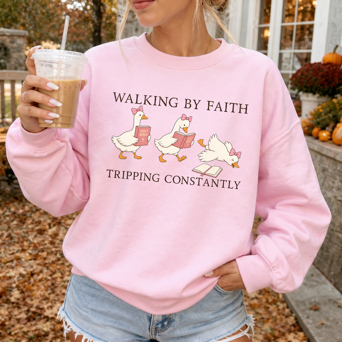 Woman wearing Walking By Faith Christian sweatshirt in Light Pink
