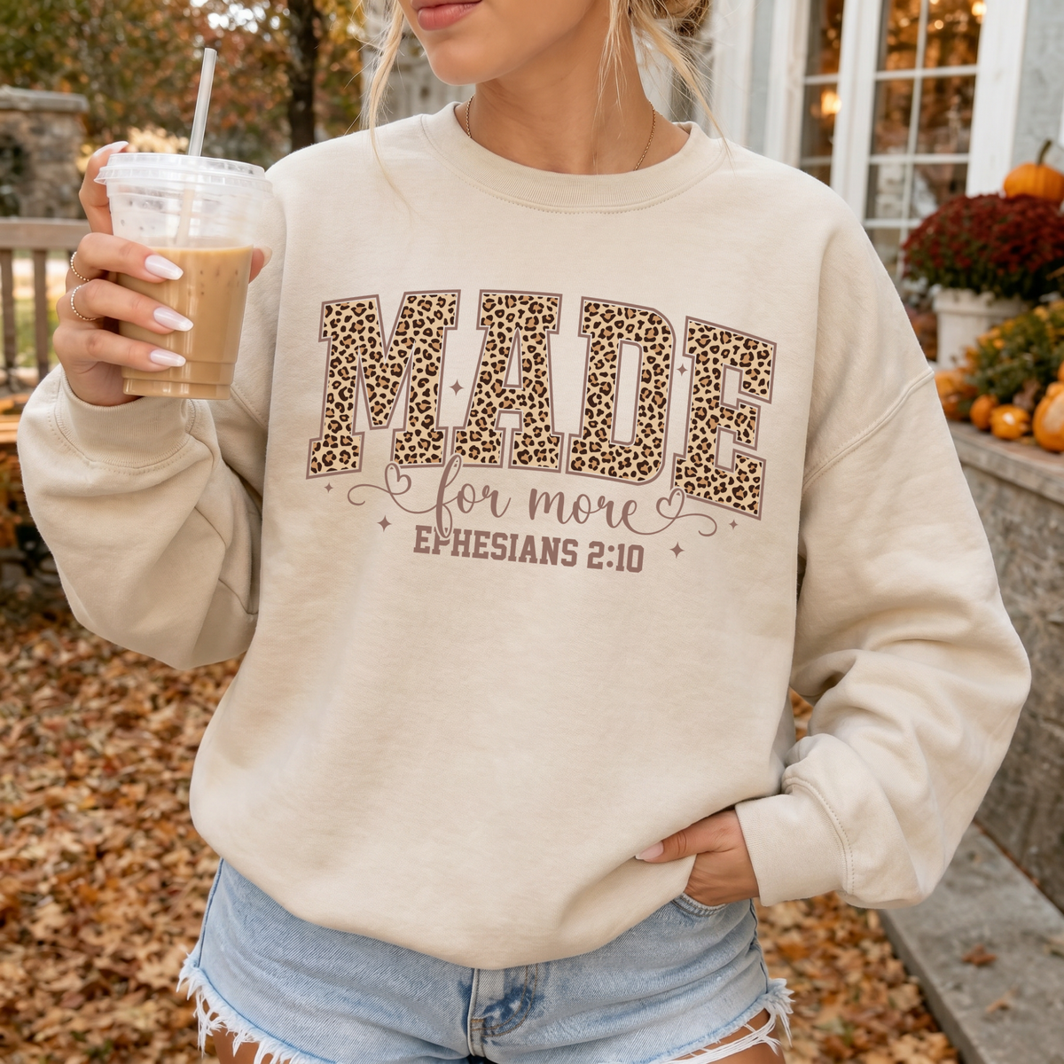 Woman wearing Made For More Christian sweatshirt in Sand