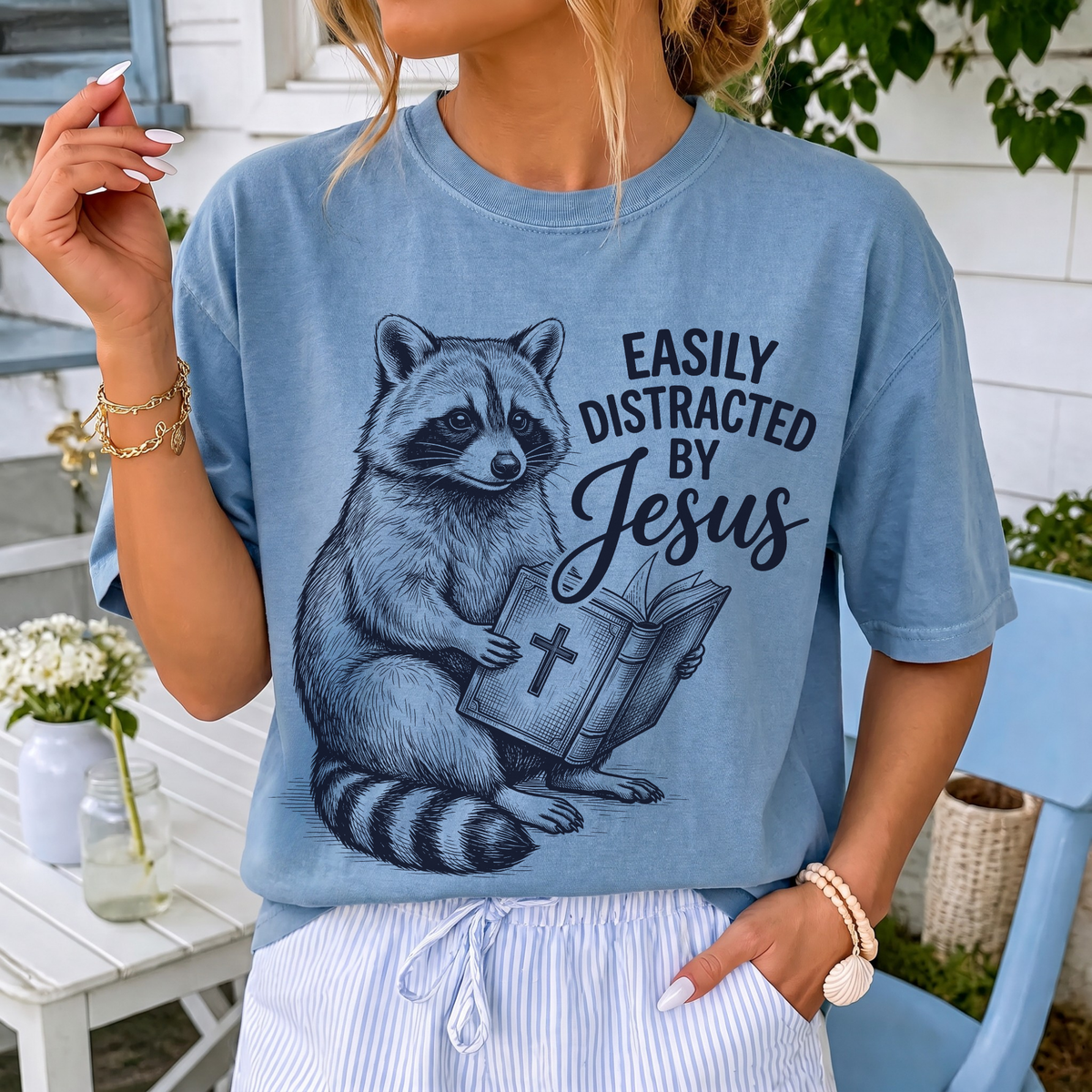 Woman wearing Easily Distracted By Jesus Christian Comfort Colors T-Shirt in Washed Denim