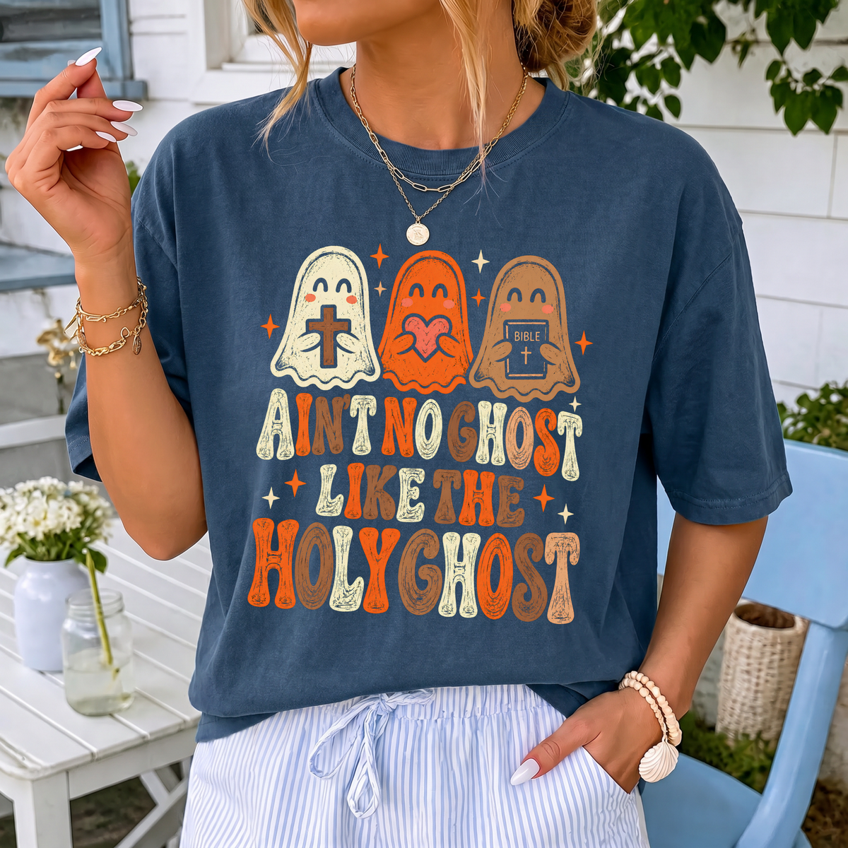 Woman wearing Ain't No Ghost Like the Holy Ghost Christian Comfort Colors T-Shirt in Midnight