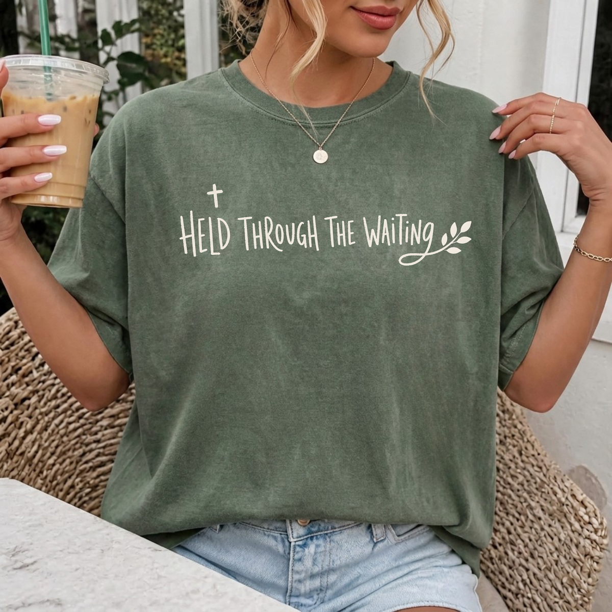 Woman wearing Held Through the Waiting Christian Comfort Colors T-Shirt in Moss