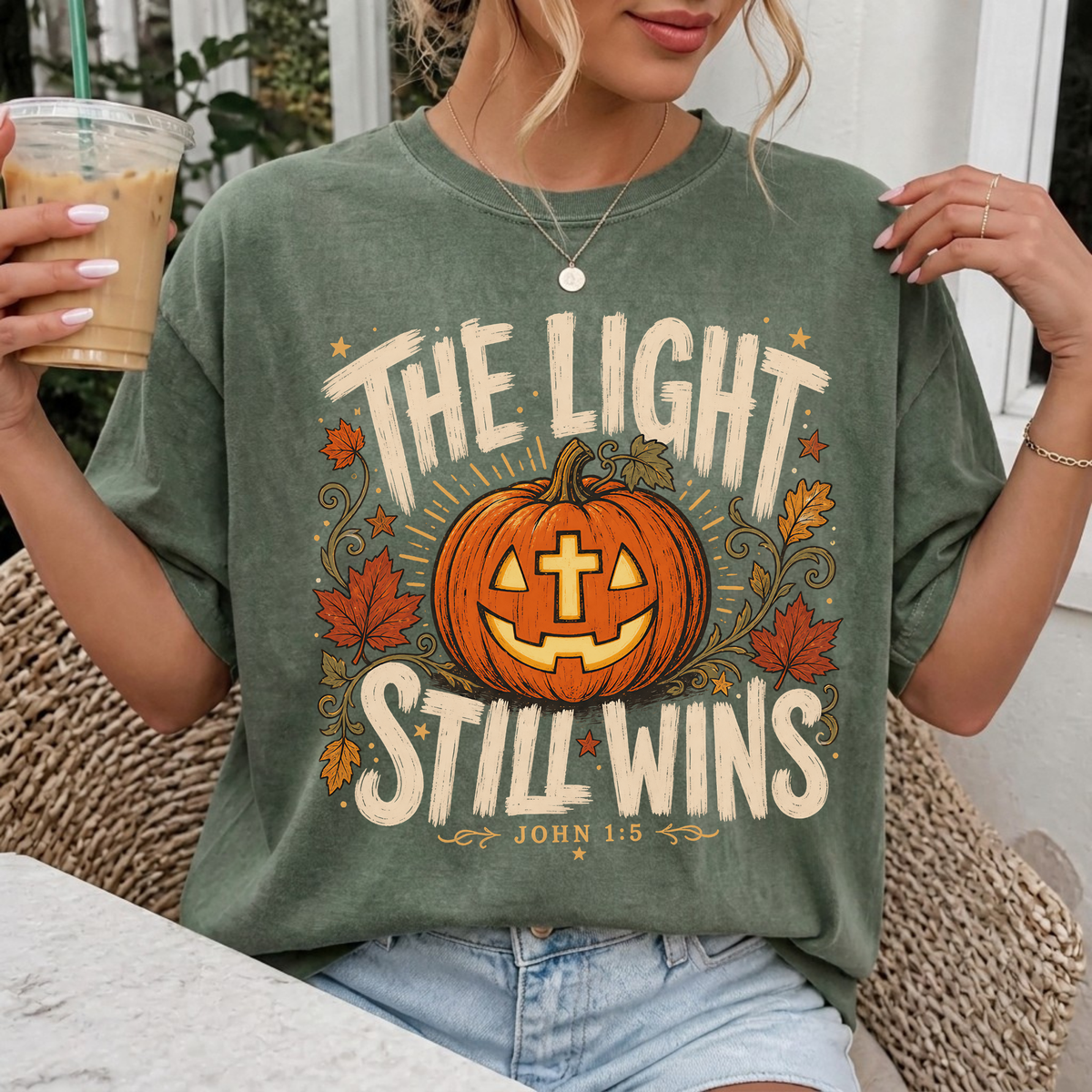 Woman wearing The Light Still Wins Christian Comfort Colors T-Shirt in Moss