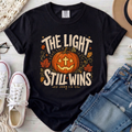 The Light Still Wins Christian Comfort Colors T-Shirt in Black