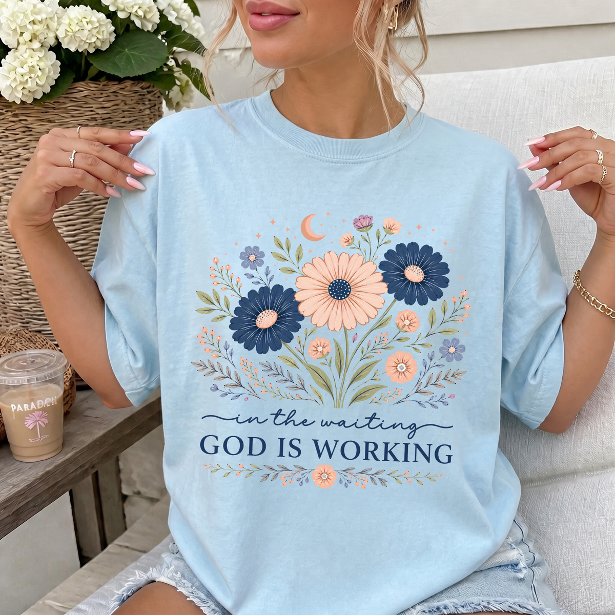 Woman wearing God Is Working Christian Comfort Colors T-Shirt in Chambray