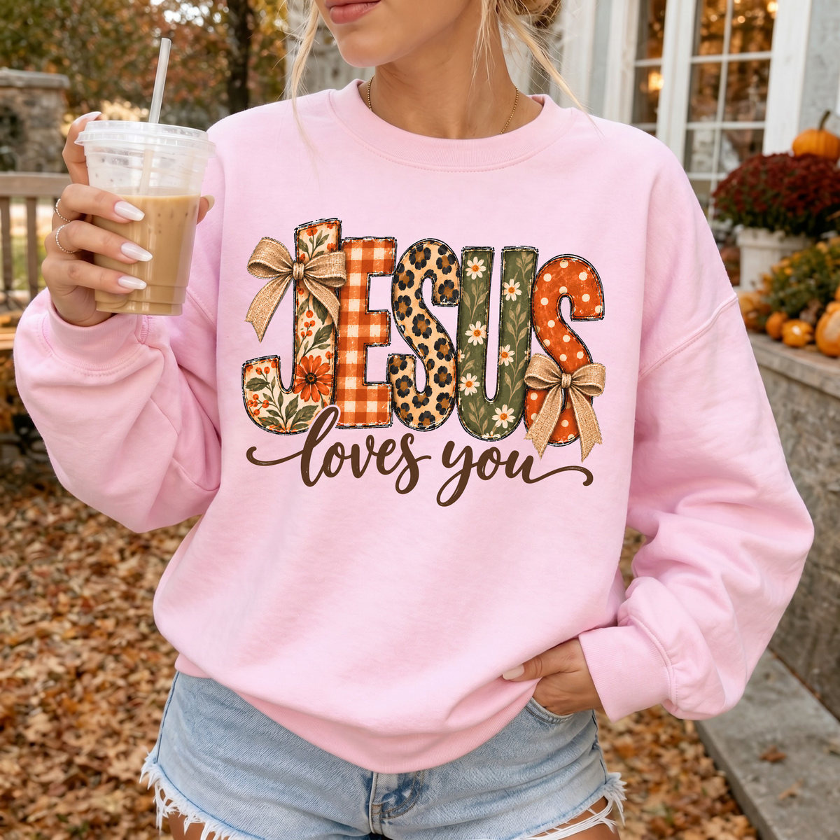 Woman wearing Jesus Loves You Christian Crewneck Sweatshirt in Light Pink