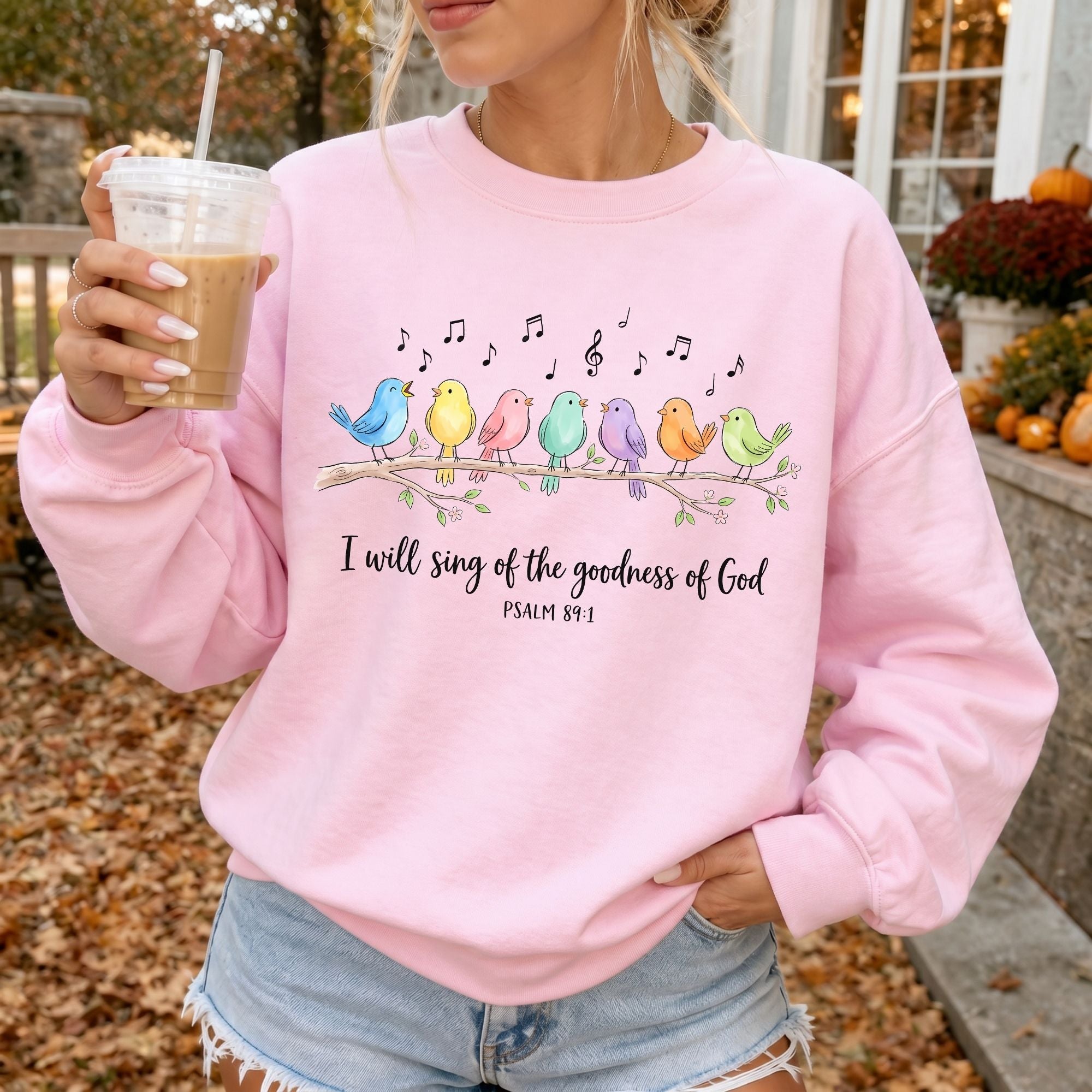 Woman wearing I Will Sing of the Goodness of God Christian sweatshirt in Light Pink